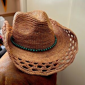 A chrochet-raffia ladies shapeable western hat, with turquoise beaded headband.